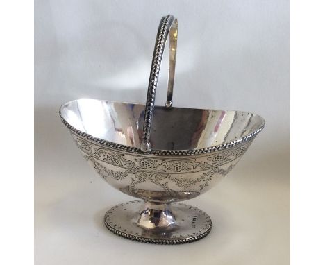 A good engraved silver sugar basin decorated with flower's and leaves. Sheffield. Approx. 153 grams. Est. £100 - £150.