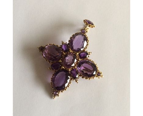 An attractive Antique Victorian amethyst pendant with large central stone to loop top. Approx. 6.5 cms long. Approx. 16.5 gra