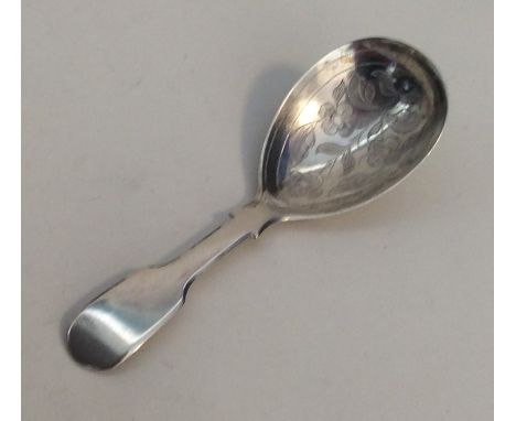 A Victorian silver fiddle pattern caddy spoon with floral decoration. London. By JB. Approx. 13.3 grams. Est. £50 - £80.
