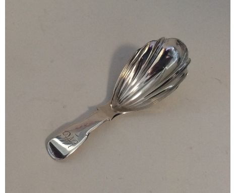 EXETER: A rare silver fluted caddy spoon of fiddle pattern design. 1844. By William Sobey. Approx. 10 grams. Est. £50 - £80.