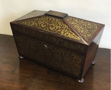 A good quality Regency brass inlaid rosewood tea caddy with fitted interior and flush fitting brass handles to bun feet. Est.