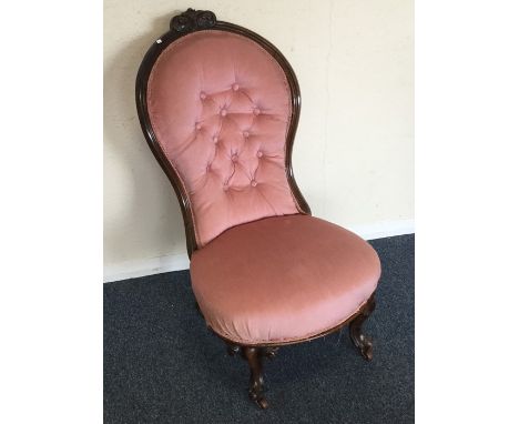 A Victorian button back mahogany nursing chair. Est. £30 - £50.