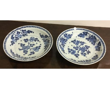 A pair of Nankin blue and white cargo plates of circular form. Seal marks to bases and signed to fronts. Approx. 20 cms in di