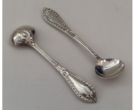 A pair of fine quality cast silver salt spoons with crested armorials. London. By Henry Wilkinson. Approx. 52 grams. Est. £45