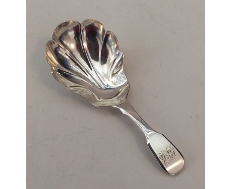EXETER: A fiddle pattern silver caddy spoon with fluted bowl. By RW. Approx. 17 grams. Est. £45 - £55.