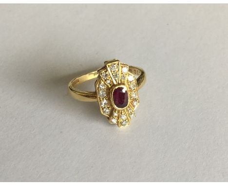 An 18 carat gold ruby and diamond Art Deco style cluster ring. Approx. 4.8 grams. Est. £150 - £200.