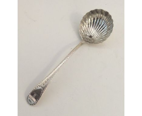 A Georgian silver sauce ladle with bright cut decoration. London. Approx 45 grams. Est. £25 - £35.