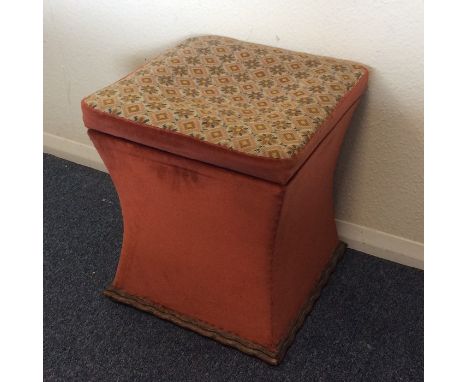 A shaped ottoman with tapestry top. Est. £10 - £20.
