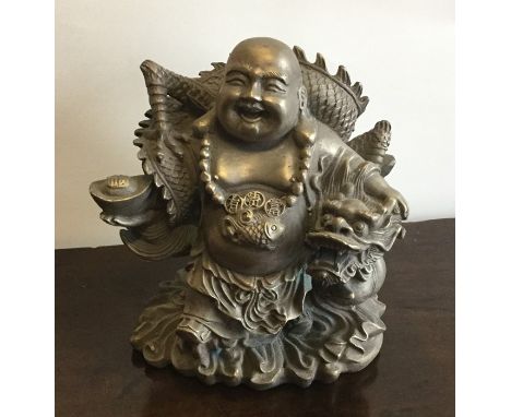 A Chinese figure of a Buddha with dragon on scroll base. Est. £30 - £50. 