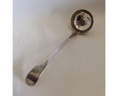 AN unusual fiddle pattern provincial silver sauce ladle. Punched 'DG'. Approx. 35 grams. Est. £50 - £80.