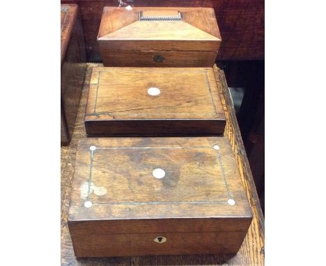 A rosewood sarcophagus shaped tea caddy together with two other caddies. Est. £20 - £30. 