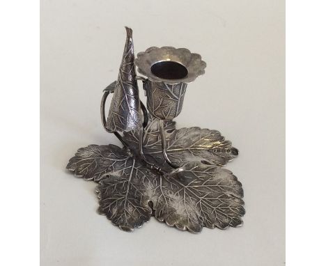 An unusual Victorian silver chamber stick and matching snuffer in the form of a leaf. London. By JW. Approx. 53 grams. Est. £