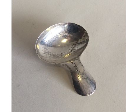 EXETER: A bright cut silver caddy spoon with oval bowl. By RJ. Approx. 8.1 grams. Est. £55 - £65.