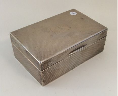 A good quality engine turned silver cigarette box. Birmingham. Approx. 436 grams. Est. £50 - £80.