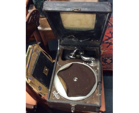 An old record player. Est. £15 - £20.