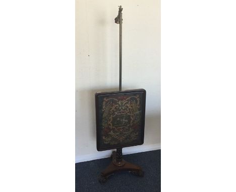A Victorian pole screen with tapestry front. Est. £50 - £80.