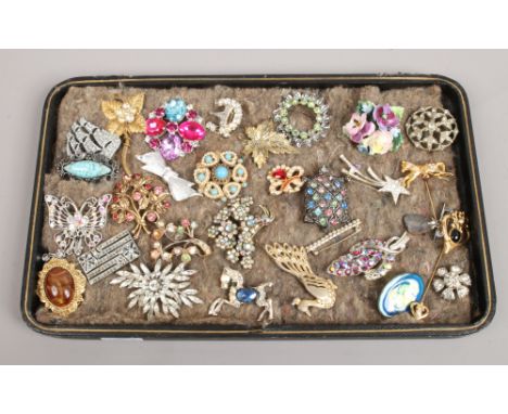 A collection of vintage brooches to include coloured and white paste stone examples.