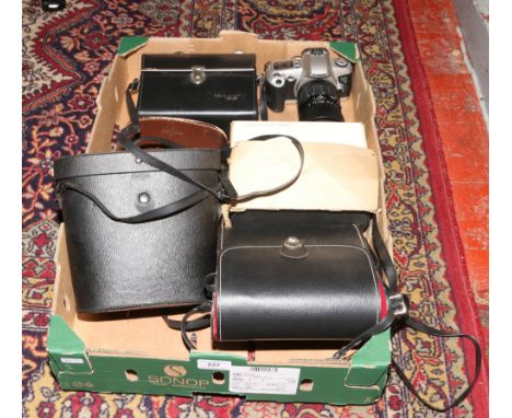 A box of binoculars and cameras to include Canon EOS 500 with Sigma zoom lens, pair of Prinz 10 x 50 binoculars, pair of Tasc