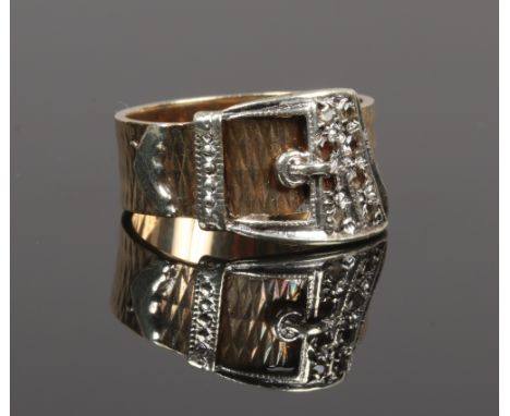A 9ct gold buckle ring set with white paste stones, size M.