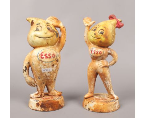 Two ESSO advertising cast iron money boxes marked Herr Tropf and Frau Tropf, standing 23.5cm tall.