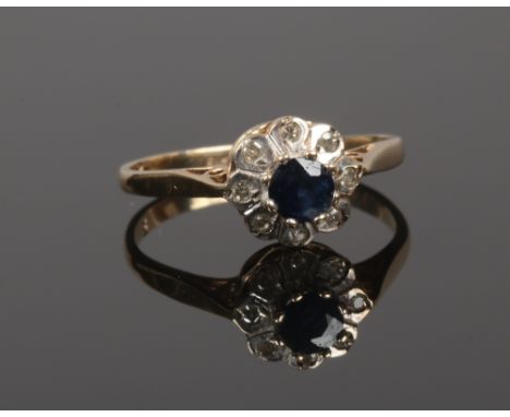 A 9ct gold sapphire and diamond daisy cluster ring, size K.