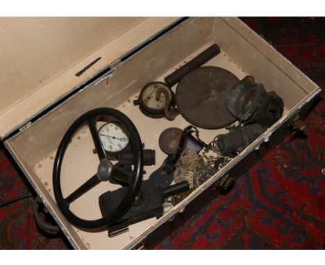 A brass bound travel trunk and contents of vintage pressure gauges, coach lamps, Salter scales and horse brasses etc.
