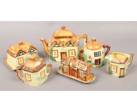 A collection of cottageware ceramics to include teapot, cruet set, butter dish etc.