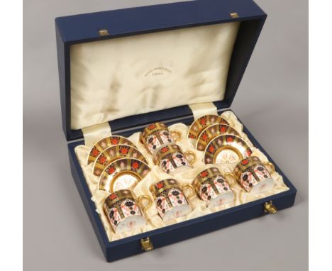 A cased Royal Crown Derby porcelain six place coffee set in the Imari design, pattern 1128. (First quality)Condition report i