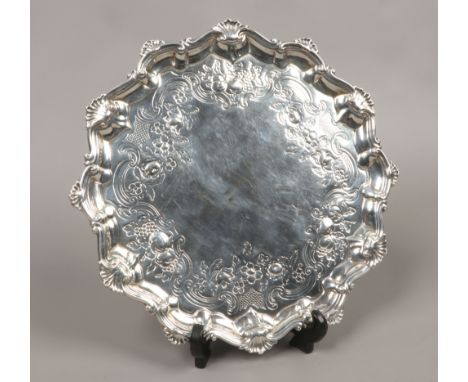A George III silver salver raised on three step feet, assayed London 1762 by Richard Rugg, 704 grams.