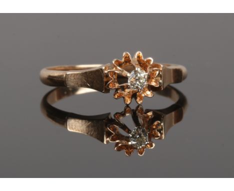 A rose gold and diamond solitaire ring in flower head setting, stone approximately 0.64ct size O1/2.