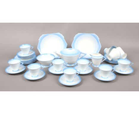A Shelley Art Deco 12 place bone china tea service with graduated blue enamel decoration including teapot, milk jug, sugar bo