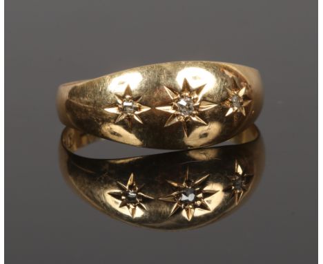 An 18ct gold gypsy set diamond ring, size M, gross weight 2.14 grams.