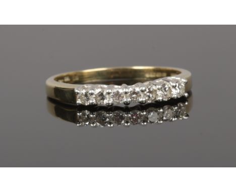A 9ct gold diamond 7 stone set ring, size P.