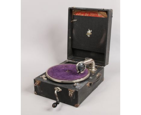 A vintage Apollo Model 5X picnic gramophone, with winding handle and a collection of six 78 records.