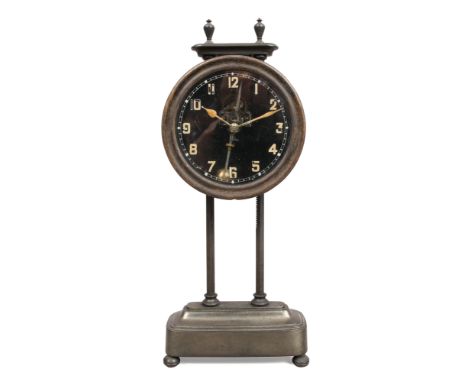 A c1920 solid brass Kee - Less Gravity clock by Watson &amp; Webb, housing a 30 hour movement and having visible escapement a