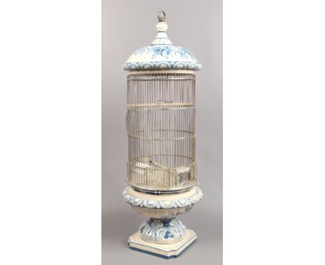 A Spanish blue and white ceramic bird cage.