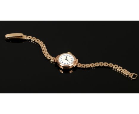 A ladies 9ct gold manual watch head on 9ct gold bracelet strap, gross weight 13.75 grams.