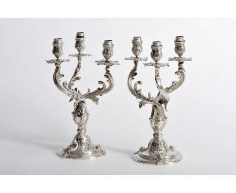 A pair of candelabra, Louis XV style, 800/1000 silver, German, 19th/20th C., signs of use, filled bottom by silver plates, wa