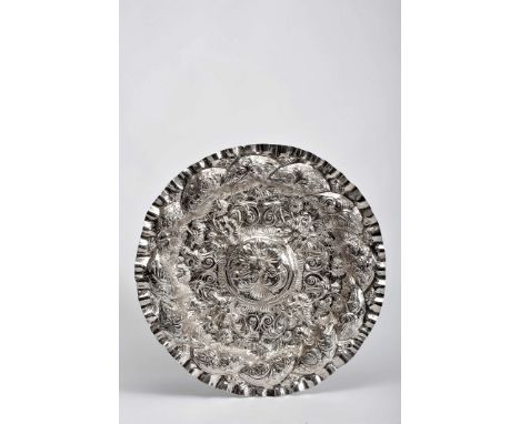 A ceremonial salver, Baroque style, silver, decoration en relief "Grotesque masks, birds and flowers", centre with relifed ma