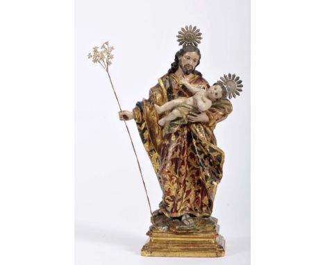 Saint Joseph with the Child Jesus, polychrome and gilt wood sculpture, carved and gilt wood base, silver halos and lily rod, 