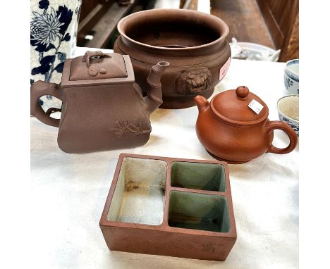 A Chinese Yixing clay teapot with lid, overall height 12cm, another smaller plain teapot; a rectangular terracotta pot with 3