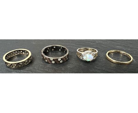 An 18ct hallmarked gold wedding ring 1.7gm; a very small 9ct hallmarked gold ring set with an opal (a.f) 2.4gm and two other 