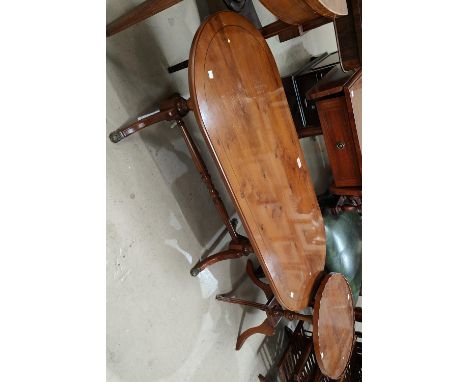 A reproduction yew wood coffee table with rounded rectangular top and twin pedestals on splay feet; a yew wood occasional tab