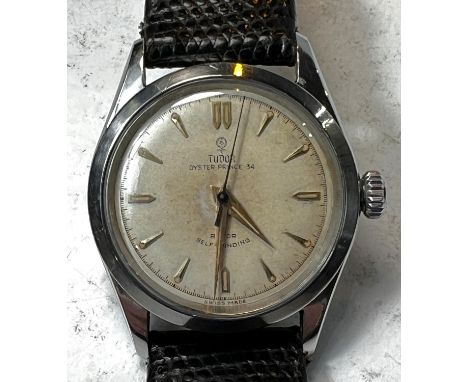 A TUDOR Oyster Prince 34 Rotor self winding gents stainless steel cased wrist watch with champagne dial and baton numerals, t