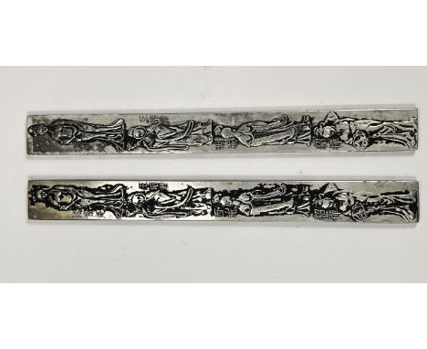 A pair of Chinese white metal embossed scholars scroll weights with impressed marks to the reverse, 23cm 