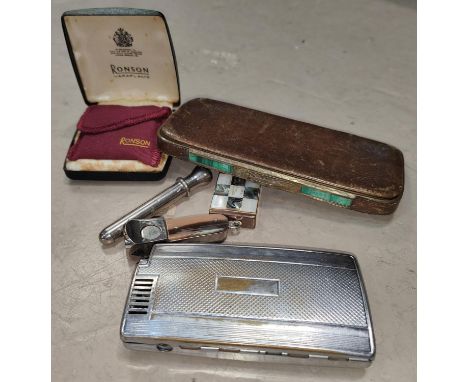 A vintage cigar cutter and a similar cigar piercer; a Ronson cigarette lighter in case; a vintage Ronson lighter with integra
