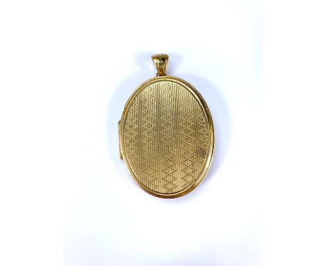 A large 9 carat hallmarked gold oval engine turned locket, 24gm. 