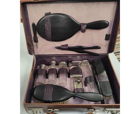 A vintage travelling vanity set in a fitted leather case.&nbsp;&nbsp; 