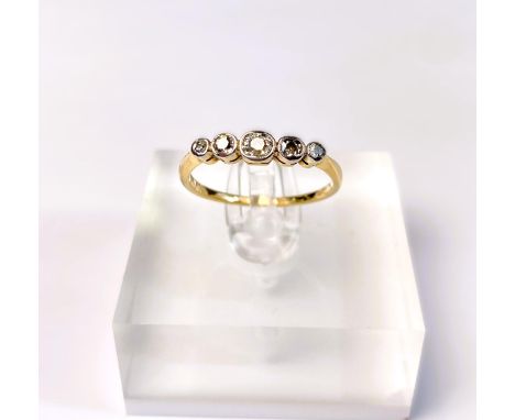 An Edwardian yellow metal ring set 5 graduating old cut diamonds, unmarked, tests as circa 18ct, size L/M, 1.8gms 