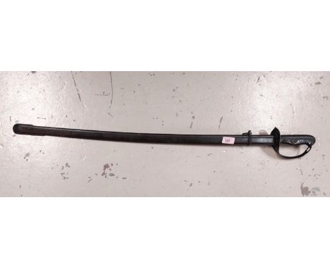 A 19th century sabre in scabbard, overall length 93cm.Some areas of discolouration to the tip end of blade; wooden grip paint